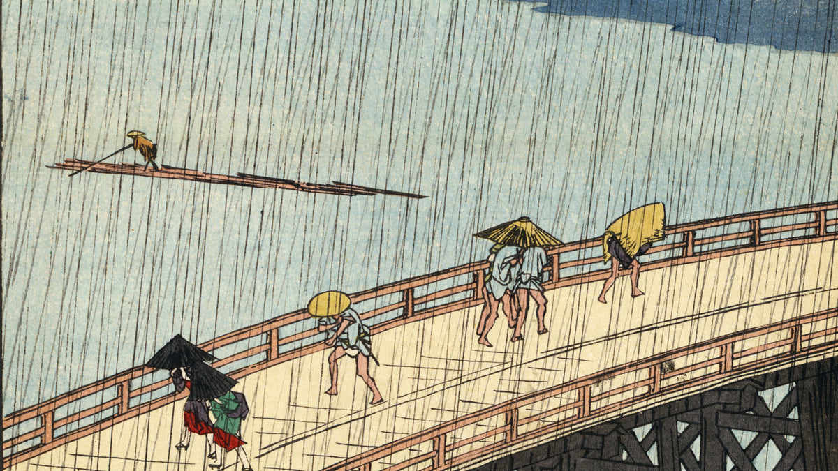 Hiroshige woodblock print, Sudden Shower over Shin-Ōhashi: figures crossing a bridge in heavy rain